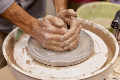 Cropped hands of man working in workshop