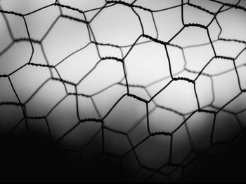 Close-up of net against white background