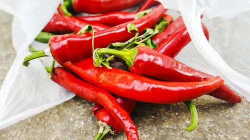 Close-up of red chili peppers on table