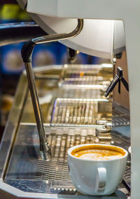 Close-up of coffee cup on table in cafe