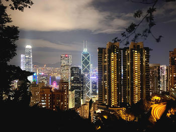 Panoramic view of illuminated buildings against sky at night