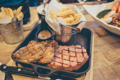 Close-up of meat cooking on barbecue grill