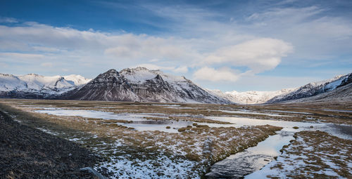 Scenic view of snowcapped mountains against sky. iceland.