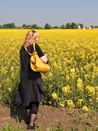 Full length of woman standing in field