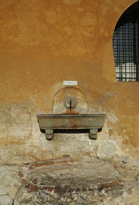 Close-up of abandoned window on wall