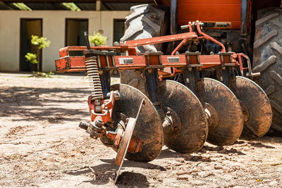 Old rusty machine on field