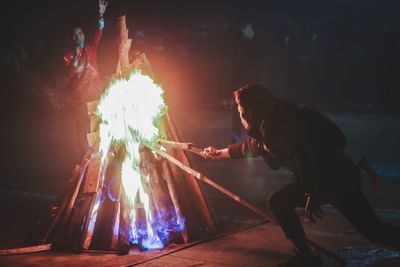 View of bonfire at night