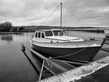 Boats moored at harbor