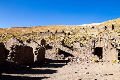 View of old ruin building against blue sky