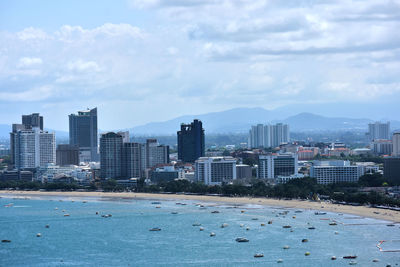 City by sea against sky