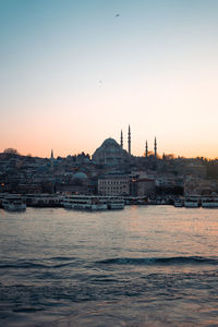 View of buildings in city at sunset