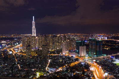 High angle view of city lit up at night