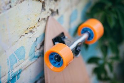 High angle view of skateboard by wall