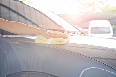 Close-up of hand holding car