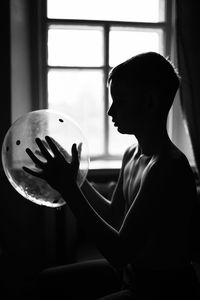 Rear view of man with arms raised