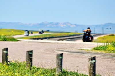 Man riding motorcycle on road