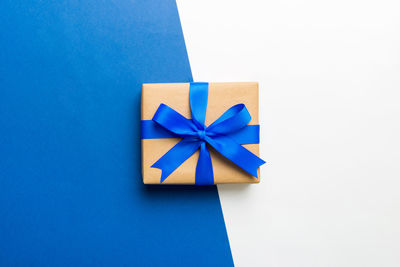 Directly above shot of gift box on blue background