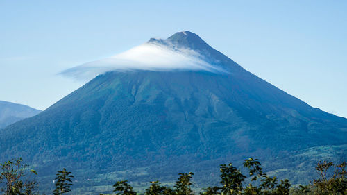 Scenic view of snowcapped mountains against clear sky