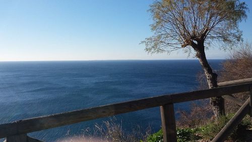 Scenic view of calm sea against clear sky