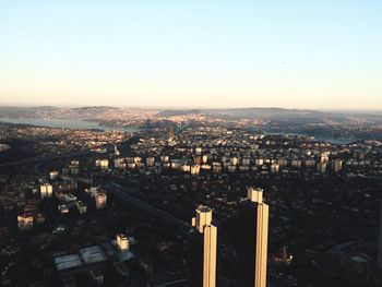 High angle view of city buildings against clear sky