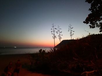 Scenic view of sea against clear sky during sunset