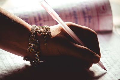 Close-up of woman hand holding cigarette