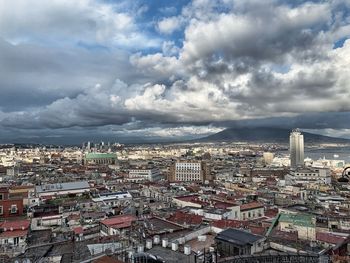 High angle view of city against cloudy sky