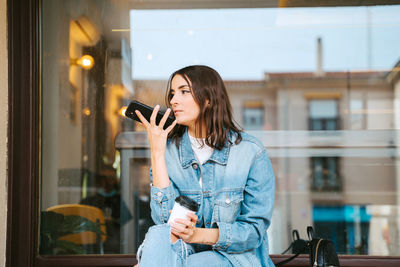 Young woman using mobile phone