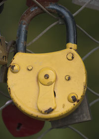 Close-up of padlocks hanging on metal