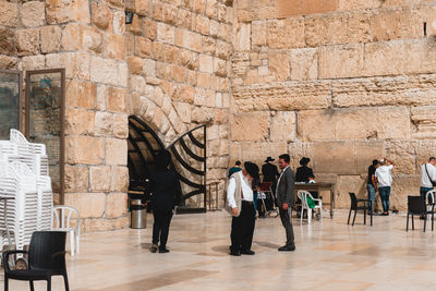 Group of people in front of wall