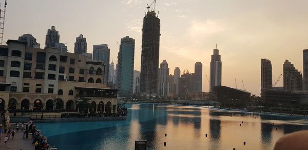 Modern buildings in city at sunset