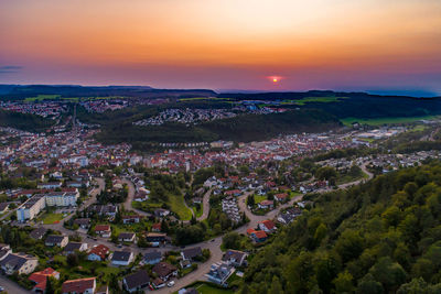 High angle view of townscape against sky at sunset