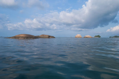 Scenic view of sea against cloudy sky