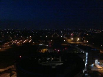 Illuminated cityscape at night