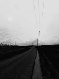 Road on field against sky