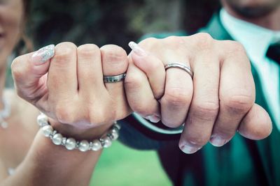 Close-up of couple holding hands