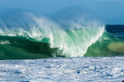 Scenic view of sea waves rushing towards shore