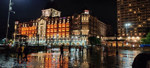 Reflection of buildings in city at night