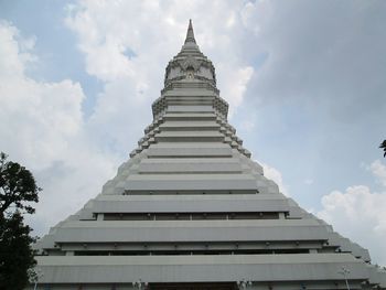 Low angle view of building against cloudy sky