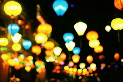 Defocused image of illuminated christmas lights at night