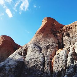 Low angle view of rock formations against sky