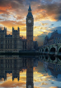 Reflection of big ben in city at sunset