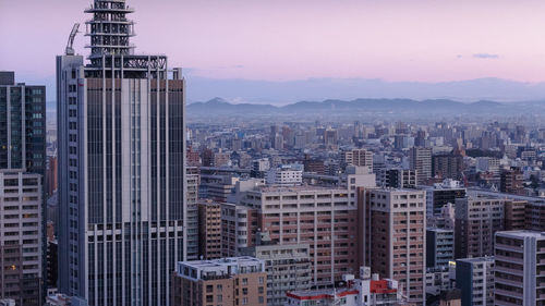 Cityscape against sky during sunset