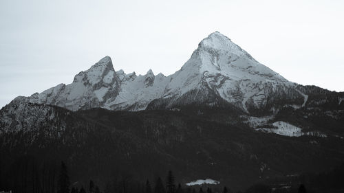 Scenic view of snowcapped mountains against clear sky