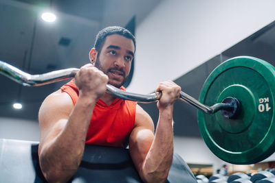 Portrait of man exercising in gym