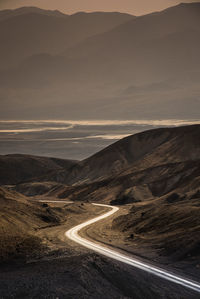 Scenic view of road passing through desert