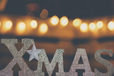 Close-up of illuminated christmas lights at night