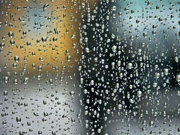 Full frame shot of raindrops on window