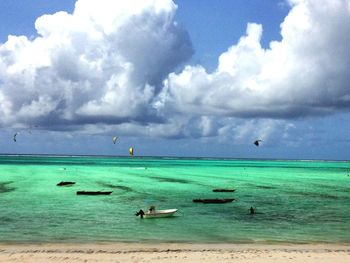 Scenic view of sea against cloudy sky