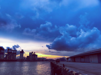 Panoramic view of buildings by sea against sky